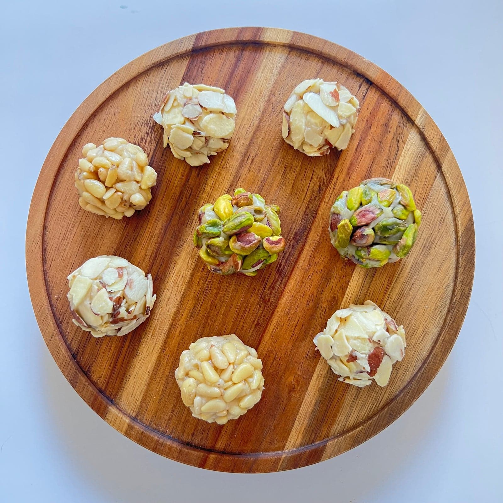 Biscuit Bubbles topped with pine nuts, pistachios and almonds