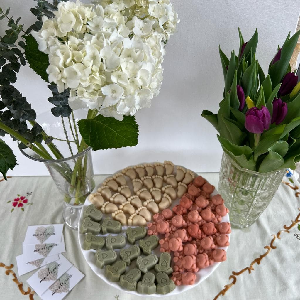 Pastel marzipan favors arranged for a baby shower